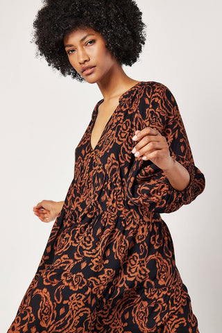 Sarasa Tiered Babydoll Dress in Rust Print